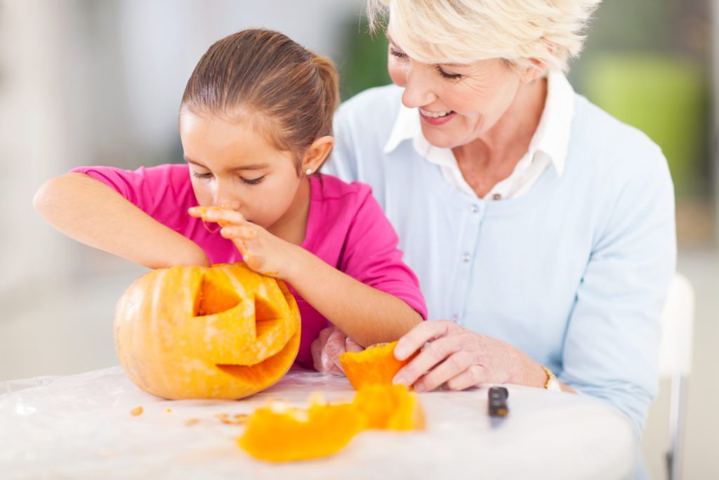 Lifestyle_Stock_Grandmother_Granddaughter_Pumpkin_56897141