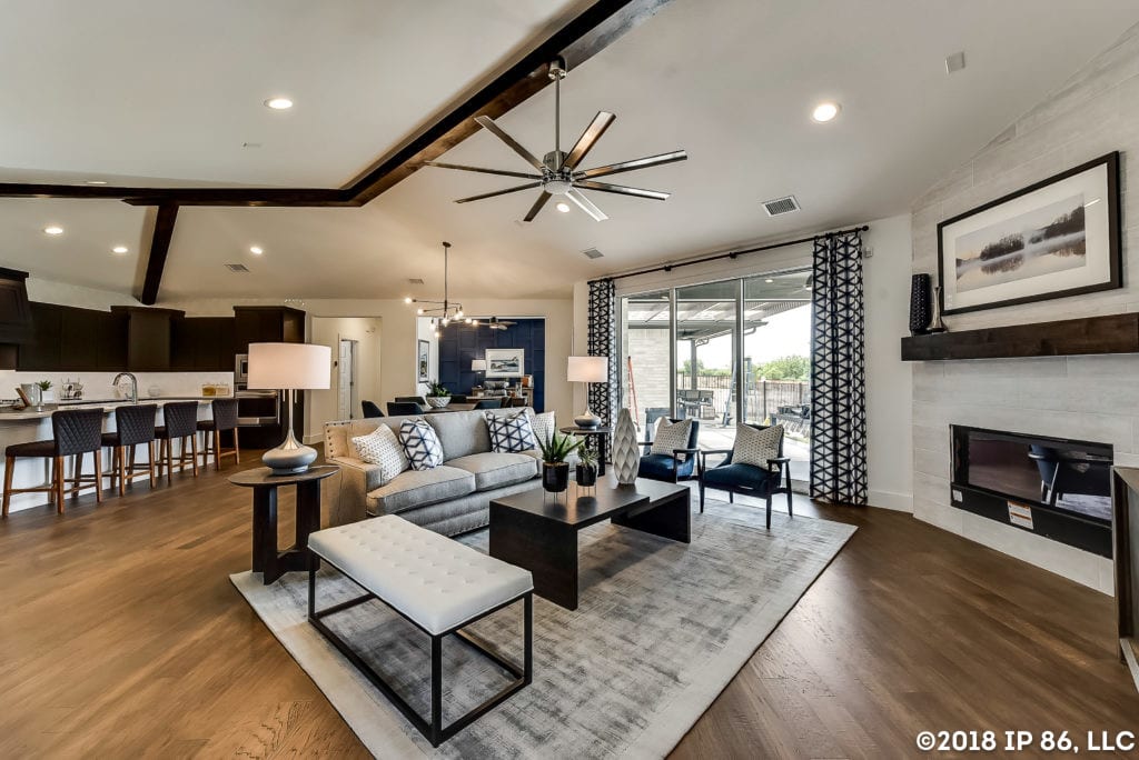 An open and connected living area with the kitchen and courtyard in view.